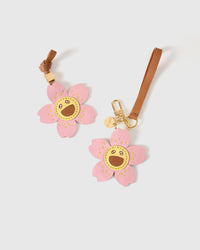 STICKYZOO Bloomy Sakura Charm with engraved gold hardware cube — handmade French Alran goatskin, soft pink and golden yellow.