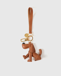 Handmade Basset Hound leather bag charm on a handbag — French Alran goatskin, hand-cut and hand-stitched. STICKYZOO.