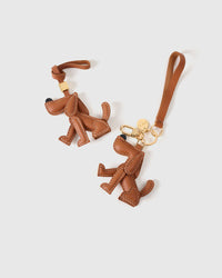 Handmade Basset Hound leather bag charm — full-grain French Alran goatskin with visible hand-stitched edges. STICKYZOO.