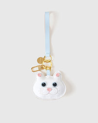 White British Shorthair on an 18K gold-plated keychain clip with engraved STICKYZOO disc — clips to keys, bags or backpacks.