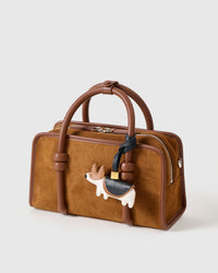 The corgi charm is made from genuine French Alran goatskin and French suede — real full-grain leather. Never vegan. Never synthetic. The difference shows.