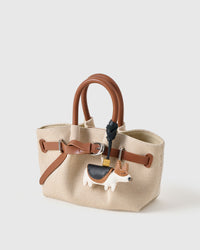 Real leather has memory. The more the corgi charm is carried, the more it deepens. The gift gets better with age.
