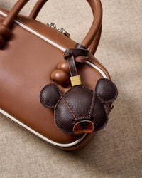 BEAR CHARM on an 18K gold-plated keychain clip with engraved STICKYZOO disc — clips to keys, bags or backpacks.