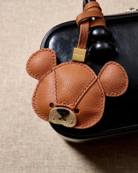 BEAR CHARM on an 18K gold-plated keychain clip with engraved STICKYZOO disc — clips to keys, bags or backpacks.