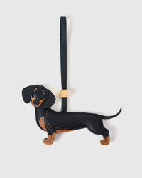 Handmade full-body Dachshund bag charm by STICKYZOO — hand-cut, hand-stitched, hand-layered French Alran goatskin over 5 days. Long Dash silhouette. Designed in Amsterdam.