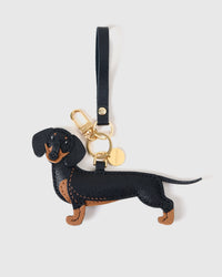 Handmade full-body Dachshund bag charm — full-grain French Alran goatskin with hand-layered black and tan markings. STICKYZOO Long Dash silhouette.
