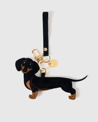 Close-up of handmade full-body Dachshund bag charm — hand-stitched visible edges on French Alran goatskin, hand-cut paws and tail. STICKYZOO Long Dash.