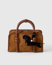 Handmade full-body Dachshund bag charm — hand-layered black coat with tan paws and snout in French Alran suede. STICKYZOO Long Dash suede edition.