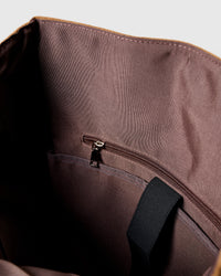 STICKYZOO Dachshund Backpack interior showing brown cotton lining, internal zip pocket, and laptop sleeve strap