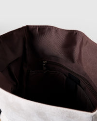 STICKYZOO Dachshund Backpack interior showing brown cotton lining, internal zip pocket, and laptop sleeve strap
