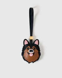 Pomeranian charm handmade from French Alran genuine goatskin and French suede — real full-grain leather from Tarn, since 1903. 3 days of hand-cutting, hand-stitching, hand-layering. Arrives in luxury gift packaging. Designed in Amsterdam.