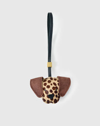 Handmade Dalmatian Spot leather bag charm by STICKYZOO — hand-cut and hand-stitched French Alran goatskin over 5 days, light brown leather ears. Designed in Amsterdam.