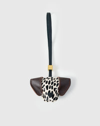 Handmade Dalmatian Spot leather bag charm by STICKYZOO — hand-cut and hand-stitched French Alran goatskin over 5 days, dark brown leather ears. Designed in Amsterdam.