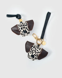 Dalmatian Spot leather bag charm shown in both attachment options — handmade French Alran goatskin, dual attachment. STICKYZOO Amsterdam design.