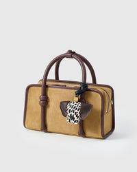 Handmade Dalmatian Spot leather bag charm clipped to a handbag — French Alran goatskin, spotted face. STICKYZOO.