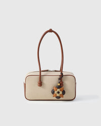 STICKYZOO Petal Espresso Charm — hand-cut, hand-stitched three-tier layered flower in French Alran goatskin. Designed in Amsterdam.