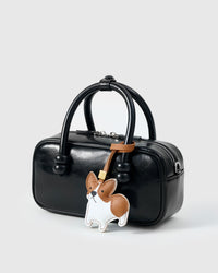 Wear the Pembroke Welsh Corgi charm on a bag with the leather strap loop, or clip it to keys with the 18K gold-plated keychain clip.