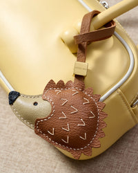 HEDGEHOG CHARM charm styled on a bag — a small, specific piece that turns a simple bag into a personal one.