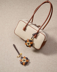STICKYZOO Petal Espresso Charm in dark chocolate, caramel, and cream French Alran goatskin. Hand-cut, hand-stitched. Designed in Amsterdam.