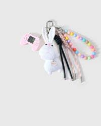 CHARME DE PILE DE LAPIN JOUEUR DE BOULES DE GOMME