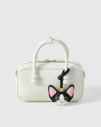Black-and-white Devon Rex on an 18K gold-plated keychain clip with engraved STICKYZOO disc — clips to keys, bags or backpacks.