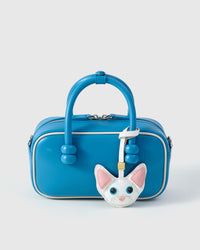 Snow-white Devon Rex on an 18K gold-plated keychain clip with engraved STICKYZOO disc — clips to keys, bags or backpacks.