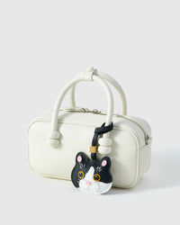 Black Muse British Shorthair on a cream box bag, side angle — Real French leather, 3 days by hand.