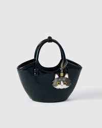 Gray European Shorthair charm styled on a bag, front view — a small, specific piece that turns a simple bag into a personal one.