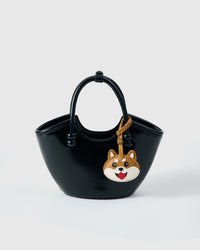 Wear the Shiba Inu face charm on a bag with the leather strap loop, or clip it to keys with the 18K gold-plated keychain clip.