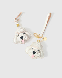 Poodle leather bag charm shown in both attachment options — handmade French Alran goatskin, dual attachment for bags or keys. STICKYZOO Amsterdam design.