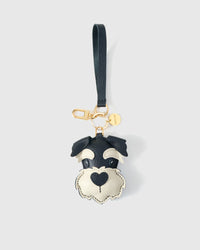 Wear the black schnauzer charm on a bag with the leather strap loop, or clip it to keys with the 18K gold-plated keychain clip.