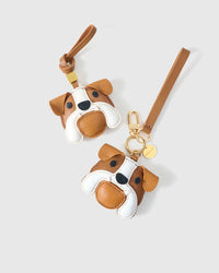 Handmade Bulldog leather bag charm on a handbag — 3 days of hand-cutting, stitching, and layering in French Alran goatskin. STICKYZOO.