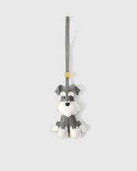 Gray Urban Schnauzer charm handmade from French Alran genuine goatskin and French suede — real full-grain leather from Tarn, since 1903. 3 days of hand-cutting, hand-stitching, hand-layering. Arrives in luxury gift packaging. Designed in Amsterdam.