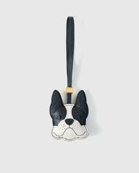 Handmade French Bulldog leather bag charm by STICKYZOO — hand-cut, hand-stitched French Alran goatskin in black with white muzzle over 3 days. Designed in Amsterdam.