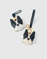 Handmade French Bulldog leather bag charm on a handbag — 3 days of hand-cutting, stitching, and layering in French Alran goatskin. STICKYZOO.