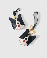 The border collie charm is made from genuine French Alran goatskin and French suede — real full-grain leather. Never vegan. Never synthetic. The difference shows.