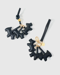 Wear the triple schnauzer charm on a bag with the leather strap loop, or clip it to keys with the 18K gold-plated keychain clip.
