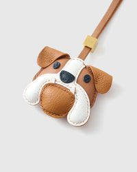 Bulldog leather bag charm shown in both attachment options — handmade French Alran goatskin, dual attachment. STICKYZOO Amsterdam design.
