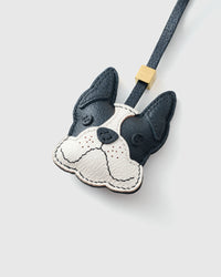 French Bulldog leather bag charm shown in both attachment options — handmade French Alran goatskin, dual attachment. STICKYZOO Amsterdam design.