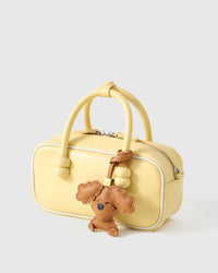 Handmade Poodle leather bag charm — French Alran goatskin from a tannery founded in 1903 in Tarn, France. STICKYZOO.