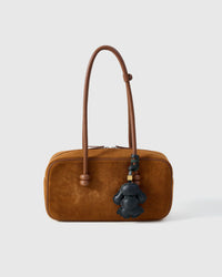 Poodle leather bag charm shown in both attachment options — handmade French Alran goatskin, dual attachment for bags or keys. STICKYZOO Amsterdam design.