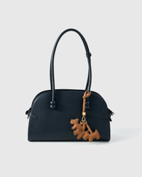 Every panel of the triple schnauzer charm is cut by hand and stitched through real French leather. Layered slowly for depth — no prints, no stamps.