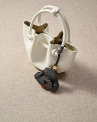 Handmade Poodle leather bag charm — built to last from full-grain French Alran goatskin, hand-layered, hand-stitched. STICKYZOO Amsterdam design.