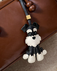 Every panel of the black urban schnauzer charm is cut by hand and stitched through real French leather. Layered slowly for depth — no prints, no stamps.