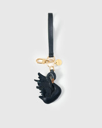 Leather swan bag charm with 18K gold-plated keychain clip and engraved STICKYZOO gold tag — for keys, bags, and backpacks. Handmade from French Alran goatskin.
