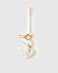 Leather swan bag charm with 18K gold-plated keychain clip, engraved STICKYZOO gold tag, and short leather loop — for keys, bags, and backpacks. Handmade from French Alran goatskin.