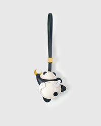 MOON PANDA CHARM charm handmade from French Alran genuine goatskin — A panda floating under a crescent moon. Arms wide, legs. Three days by hand. Arrives in luxury gift packaging. Designed in Amsterdam.