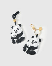 Both editions of the panda charm — leather strap loop for bags, or 18K gold-plated keychain clip.