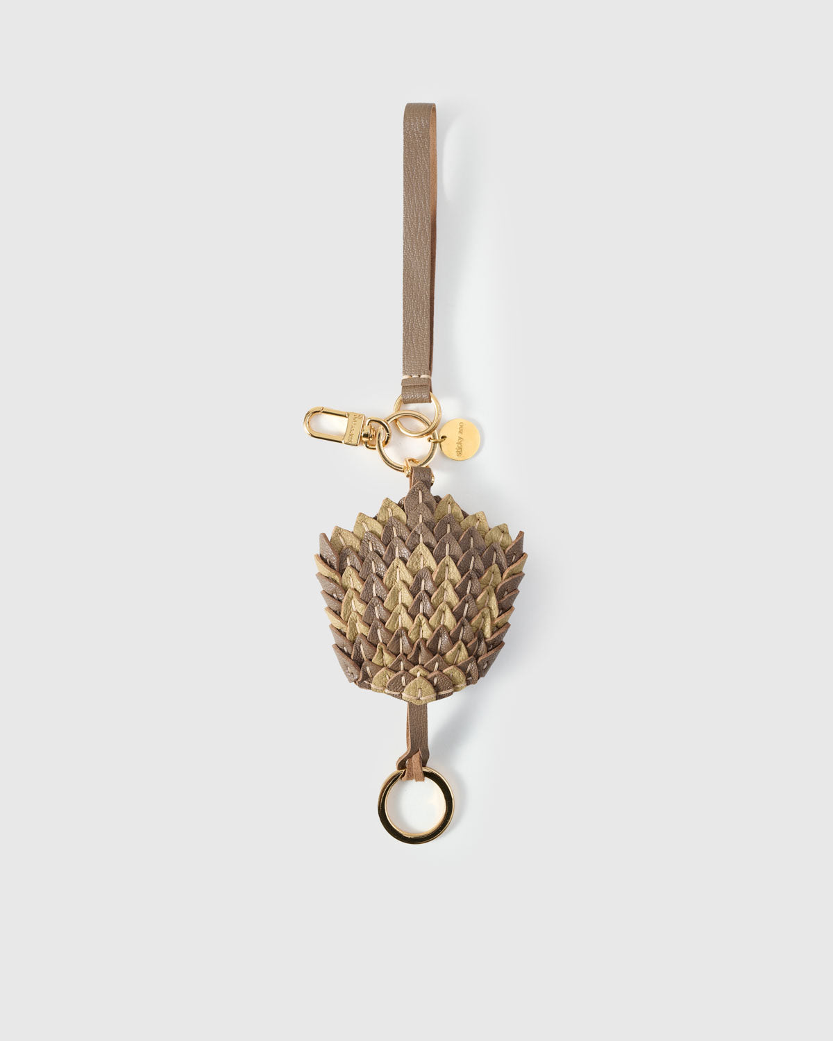 Scaled charm on an 18K gold-plated keychain clip — clips to keys, bags or backpacks.