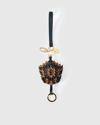 Black-and-caramel scaled charm — loved by thousands of buyers. Real French leather.